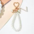 Detail of pearl letter J keychain with gold heart clasp and handmade tag - Letter Z Style / Pearl White