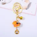 Charming orange zodiac horse ceramic keychain featuring a golden bell and secure lobster clasp - Horse