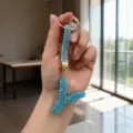 Detail of blue rhinestone letter Y keychain with sparkling crystals and gold ring - Letter Y