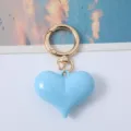 Fashionable blue acrylic heart keychain for bags and car keys with gold clasp. - Blue