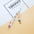 Japanese Maneki-neko lucky cat phone strap with golden Sakura charm and bell accessory - Independent OPP Bag Packaging / Blue