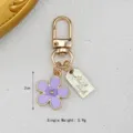 Korean style purple enamel daisy flower keychain with golden lobster clasp and handmade tag - Daisy Pendant (With Hand Made Tag) / Purple