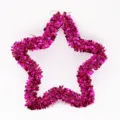 Macro view of a 35cm star-shaped Christmas decoration in shimmering pink tinsel - Rose Red