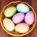 Detailed view of colorful glitter foam Easter eggs set in a yellow basket for holiday decoration - Style 6