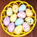 Colorful speckled foam Easter eggs arranged in a yellow basket for DIY holiday decor - Style 8