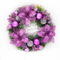 Close-up view of 40cm Christmas wreath with purple glitter flowers and Merry Christmas sign - 30cm / Pink