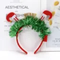 Detail shot of a festive green tinsel headband with upside-down elf legs and bells - Feather Silk Long Legs Headband (RL569-3)