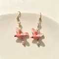 Exquisite handmade pink ceramic pigeon earrings featuring elegant pearls and gold hooks - Pink