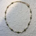 Detail view of a natural freshwater pearl and mixed stone necklace with gold beads. - Unakite - Necklace