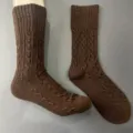 Close-up detail of brown cable-knit wool socks, showing fine texture and quality craftsmanship. - 36-40 / Color 2