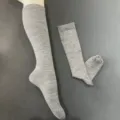 Detailed shot of grey merino wool over-the-knee compression socks with fine knit texture. - 36-40 / Gray