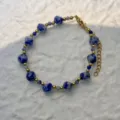Elegant blue marbled square beads and gold metal beads bracelet detail for beach wear - Bracelet / Blue Spot Stone
