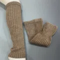Detailed view of brown vertical striped knit wool calf slouch socks, cozy daily wear. - One Size / Brown