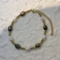 Close-up of mixed natural stone and freshwater pearl beaded bracelet with gold clasp - Unakite - Bracelet