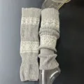 Close-up of grey wool knit leg warmers, showing retro pattern and soft texture details. - One Size / Light Gray