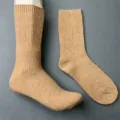 Detailed view of solid color ribbed knit wool blend mid-tube socks in versatile camel color. - 36-40 / Rosy Red 1