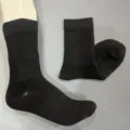 Black merino wool ribbed mid-calf sock close-up, showing detailed knit texture and fabric quality. - 36-40 / Black