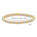 Detailansicht eines elastischen Perlenarmbands aus 6 mm Gold- und Silber-Edelstahl-Schmuck. - 6mm Gold und Silber Zweifarbig