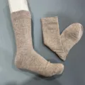 Detailed view of men merino wool crew socks in khaki, comfortable ribbed design for hiking. - 41-46 / Khaki