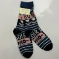 Detail view of designer cotton mid-calf socks with floral pattern and letter knit print. - Style 31