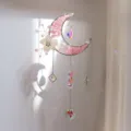 Detailed view of a crescent moon sun catcher with pink stones and heart crystal prism. - Rose Quartz Style / 51cm