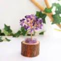 Detailed view of handmade amethyst crystal tree of life on natural wooden stump base - Amethyst / 13cm Version