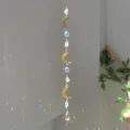 Decorative natural crystal suncatcher with golden moon charms creating dreamlike light reflections - Crescent White Stone Style (GF01) / 71-81cm