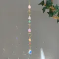 Close-up of a natural crystal suncatcher hanging ornament with rainbow light effects - Mixed Stone Style (GF02) / 71-81cm