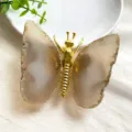 Close-up of golden butterfly ornament with natural agate stone wings for home decor. - Gold Body / Gray