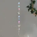 Detailed view of a garden sun catcher with natural pink crystals and butterfly prisms - Butterfly Pink Stone Style (GF08) / 71-81cm
