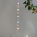 Detailed macro view showing rainbow light refractions from a crystal stone suncatcher - Sun Moon Mixed Stone Style (GF09) / 71-81cm