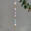 Close-up detail of natural rose quartz suncatcher with beautiful rainbow light reflections - Lotus Pink Stone Style (GF05) / 71-81cm