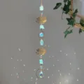 Detail of crystal suncatcher with raw green stones and gold lotus in natural sunlight - Lotus Green Stone Style (GF06) / 71-81cm