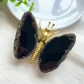 Detailed view of handmade butterfly ornament featuring natural agate wings and gold metal body - Gold Body / Black