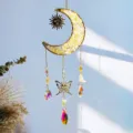 Detailed view of moon suncatcher with yellow crystals, butterfly charm and rainbow drops. - Yellow Crystal Style / 40CM