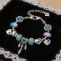 Elegante bracciale con ciondoli fai-da-te con cuori e perle di vetro blu e viola - 16cm / Stile Piuma Blu Fantasia (Z-003)