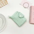 Mint green pleated mini coin purse featuring snap closure and handy portable clip - Green