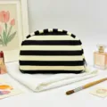 Elegant black and white striped shell cosmetic bag with a decorative tassel and pom-pom - Black Stripe