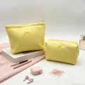 Dos neceseres amarillos de nido de abeja con lazos y accesorios de viaje rosas. - Bolso de mano / 20x18x5.5cm / Amarillo