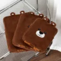 Close-up view showing the soft texture of brown plush bear laptop sleeves with embroidery - 11" / Bear Head