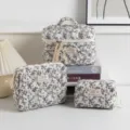 Floral quilted cosmetic bag set in three sizes for travel and home storage - Large Cosmetic Bag / Black floral three-piece set