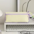 Detailed macro view of a color-blocking creamy yellow and purple canvas pencil case - Purple Yellow Colorblock