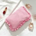 Detailed view of red and white seersucker striped cosmetic bag with ruffle edges - Red