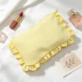 Yellow and white striped seersucker makeup bag with ruffle trim on white fabric. - Yellow