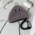 Close-up of gray plush rice ball coin purse with cute eye embroidery and spiral keychain. - 13*12cm / Gray