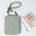 Sage green crossbody tablet sleeve with embroidered detail and adjustable shoulder strap - Light Green / 11"