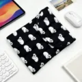 Detailed view of the black quilted laptop sleeve with white cartoon cat pattern - 11" / Black with White Cat