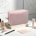 Premium pink seersucker gingham cosmetic bag with large capacity for travel and daily storage - Lotus Pink