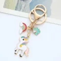 Close-up of a cute alloy enamel unicorn keychain featuring rainbow and pony charms - Single OPP Bag Packaging / Rainbow Horse Pink