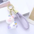 Detailed view of a cute cartoon resin unicorn keychain with purple braided strap - Single Piece / Purple Unicorn